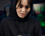 woman looking at smartphone security warning