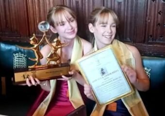 identical twin archers receiving award in Houses of Parliament