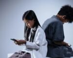 teenage boy girl using phone