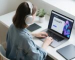 freelancer using chatgpt ai laptop home cat desk