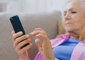 elderly person using smartphone