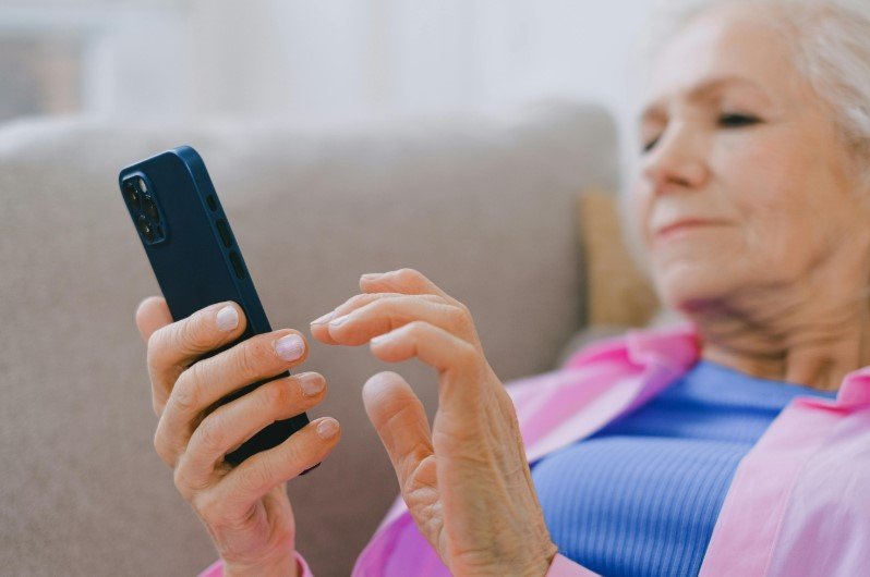 elderly person using smartphone