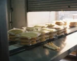 Stacked Chinese pancake packs on a halted food production line.