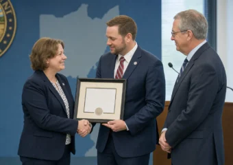 Amy Wood accepts Mid-Ohio ESC three-star BAC award with Tressel
